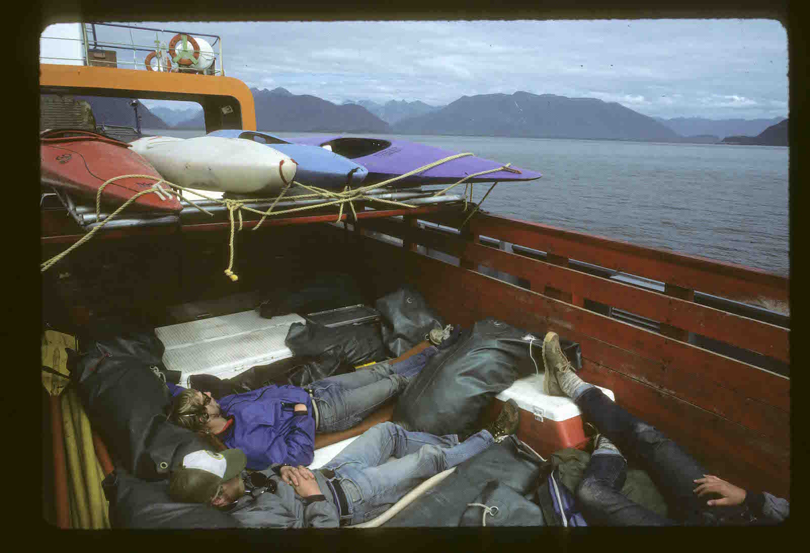 Our truck on the ferry from Chaiten to Chilhoe after the trip. Dan Bolster and Brad Lord. Note the 1980 era river footwear | Photo: Peter Fox