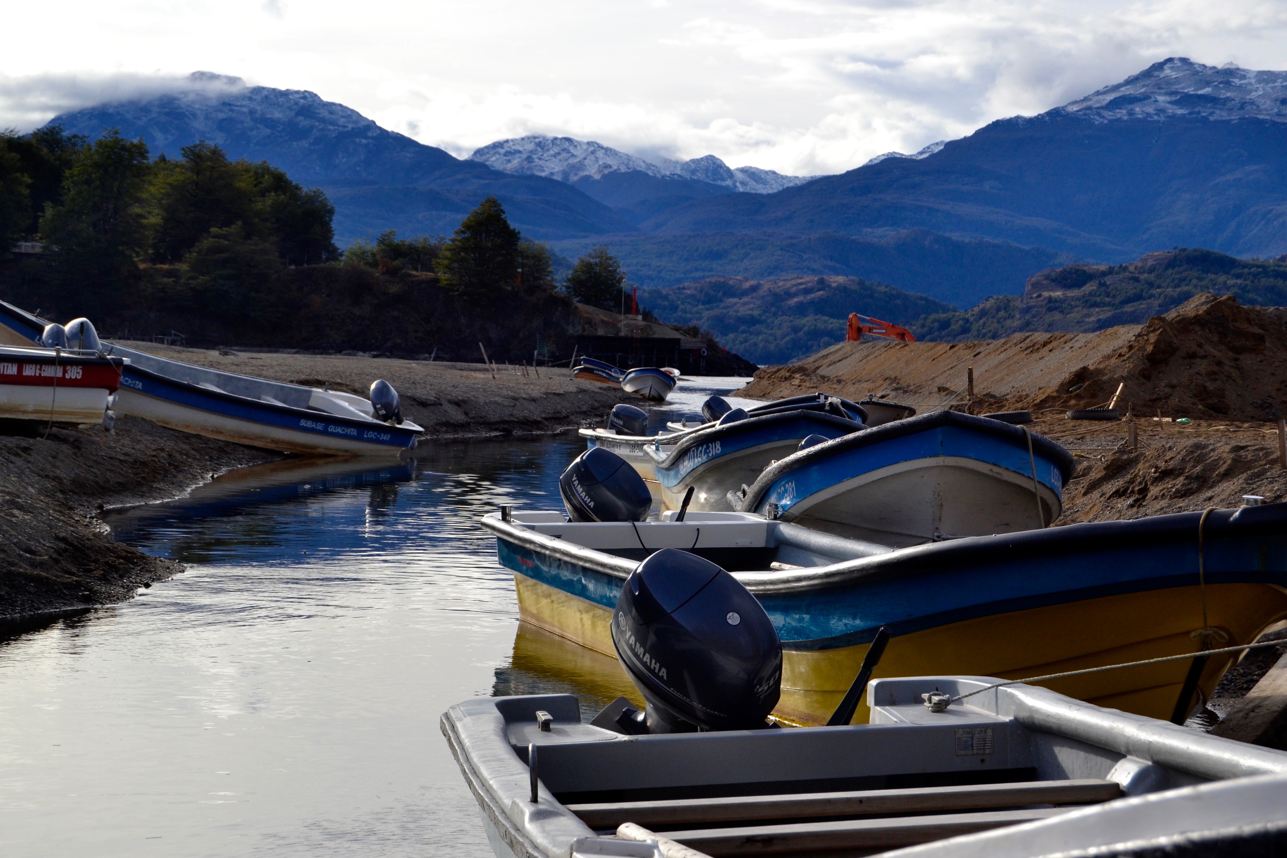 The small boats stand at Lake General Carrera's shore, where the main touristic atraction is Capillas de Mármol.